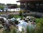 extior view of custom designed  Frank lloyd wright inspired custom home plans by former taliesin fellow house showing cultured stone