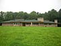 Exterior view of custom home michael Rust architect  Frank lloyd wright inspired custom home plans by former taliesin fellow