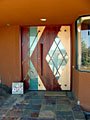 Slate flooring and stained glass foyer michael Rust architect  Frank lloyd wright inspired custom home plans by former taliesin fellow