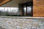 Use of stone veneer fencing  Frank lloyd wright inspired custom home plans by former taliesin fellow